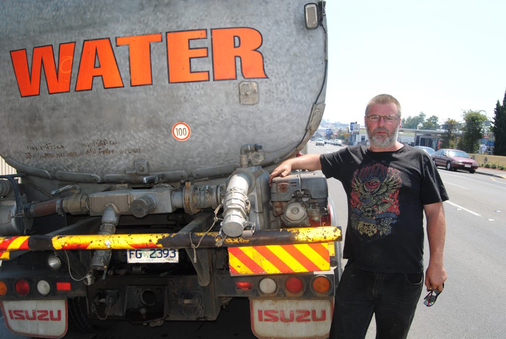 Jason Nichols about to deliver more water to Forcett. Photo Alf Wilson / Big Rigs Jason Nichols about to deliver more water to Forcett. Photo Alf Wilson / Big Rigs