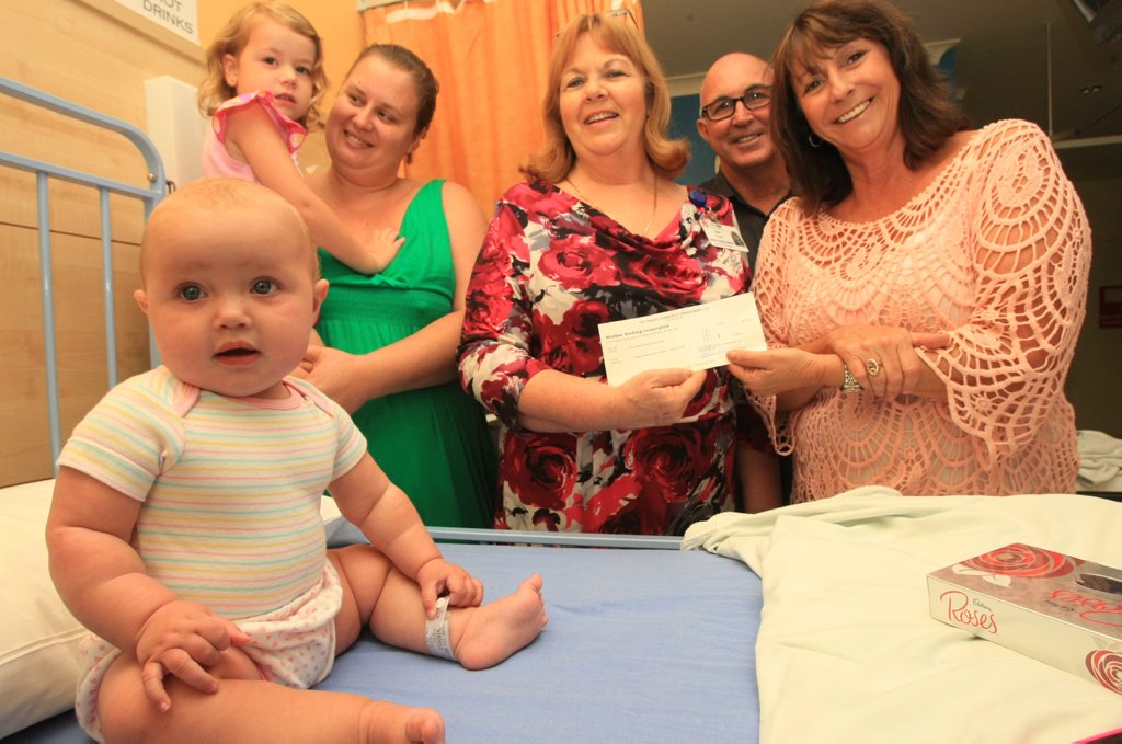 Lisa Tyler with daughter Jemma, Ann Schefe(Director of Nursing), Trevor Shearn and Leone Crayden with recovering baby Layla Fairchild(front). Photo Blainey Woodham / Daily News Lisa Tyler with daughter Jemma, Ann Schefe(Director of Nursing), Trevor Shearn and Leone Crayden with recovering baby Layla Fairchild(front). Photo Blainey Woodham / Daily News