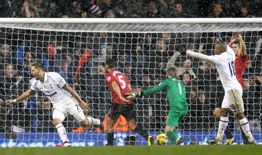 Clint Dempsey of Tottenham Hotspur turns to celebrate after scoring the equalising goal in stoppage time during the Barclays Premier League match between Tottenham Hotspur and Manchester United at White Hart Lane on January 20, 2013 in London, England. Clint Dempsey of Tottenham Hotspur turns to celebrate after scoring the equalising goal in stoppage time during the Barclays Premier League match between Tottenham Hotspur and Manchester United at White Hart Lane on January 20, 2013 in London, England.