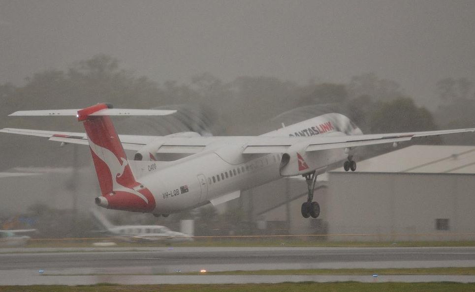 Facebook liker Jamie Chinery sent in this photo of a Qantaslink flight to Brisbane taking off from Gladstone airport in the rain this morning. Rain can be seen spiralling off the blades. Facebook liker Jamie Chinery sent in this photo of a Qantaslink flight to Brisbane taking off from Gladstone airport in the rain this morning. Rain can be seen spiralling off the blades.