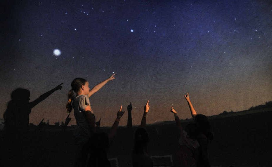 ANOTHER WORLD: Emily Bloomfield, 10, points to the stars with her friends at the Lismore Art Gallery to see the StarLab Cosmodome Show. ANOTHER WORLD: Emily Bloomfield, 10, points to the stars with her friends at the Lismore Art Gallery to see the StarLab Cosmodome Show.