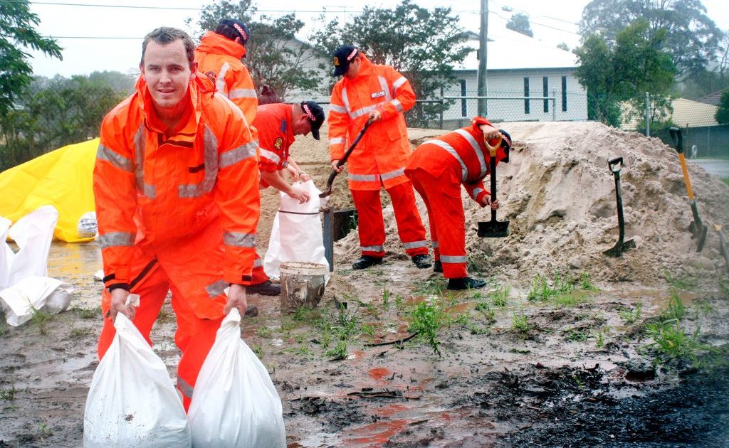 SES worker Peter Koplick joins fellow volunteers at the Daisy Hill Depot in filling sandbags to help local residents fight this weeks flood. Photo: Chris Owen / The Satellite Photo: Chris Owen / The Reporter SES worker Peter Koplick joins fellow volunteers at the Daisy Hill Depot in filling sandbags to help local residents fight this weeks flood. Photo: Chris Owen / The Satellite Photo: Chris Owen / The Reporter