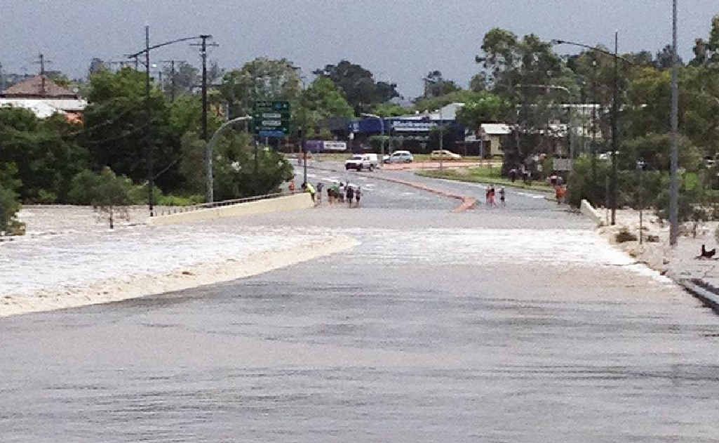 NO GO: Flooding closes the road at One Mile. NO GO: Flooding closes the road at One Mile.