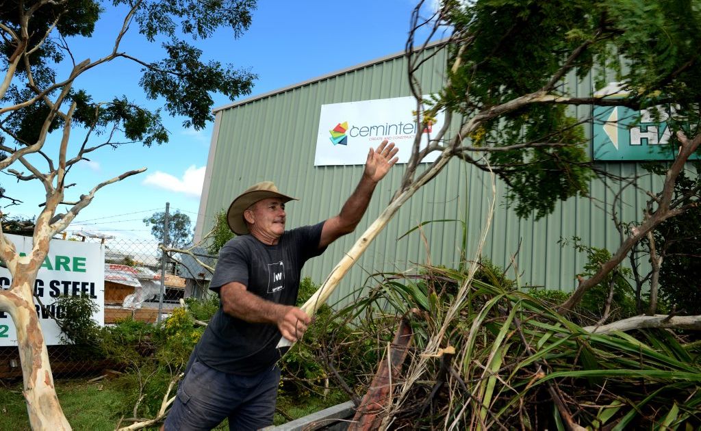 David Millar clears some trees after the storm in Tweed Heads South on Tuesday. David Millar clears some trees after the storm in Tweed Heads South on Tuesday.
