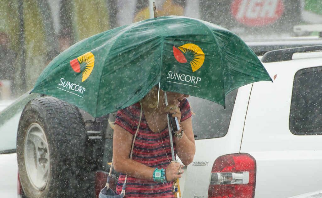 Heavy rain and wind from ex-tropical cyclone Oswald made umbrellas a must-have accessory. Heavy rain and wind from ex-tropical cyclone Oswald made umbrellas a must-have accessory.
