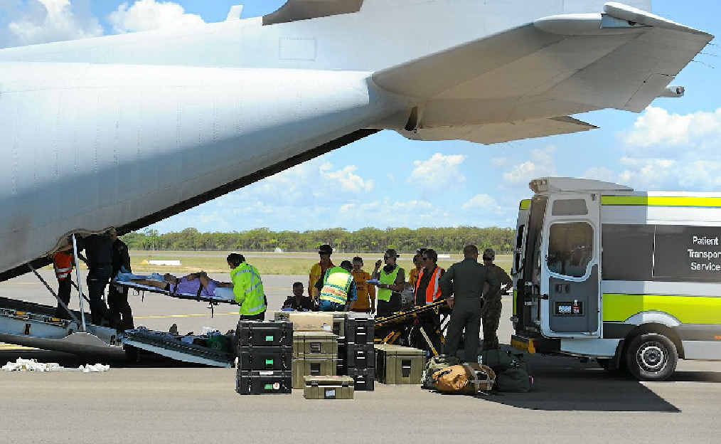 Patients from Bundaberg Hospital are loaded into the Hercules aircraft to be airlifted to Brisbane. Patients from Bundaberg Hospital are loaded into the Hercules aircraft to be airlifted to Brisbane.