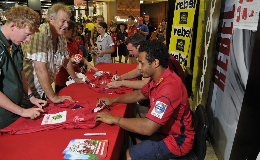 Scott Tiran (left) and Michael Weston join the queque at Rebel Sport Grand Central today to have merchandise autrographed by Queensland Red players David MdDuling (left) and Will Genia. Scott Tiran (left) and Michael Weston join the queque at Rebel Sport Grand Central today to have merchandise autrographed by Queensland Red players David MdDuling (left) and Will Genia.