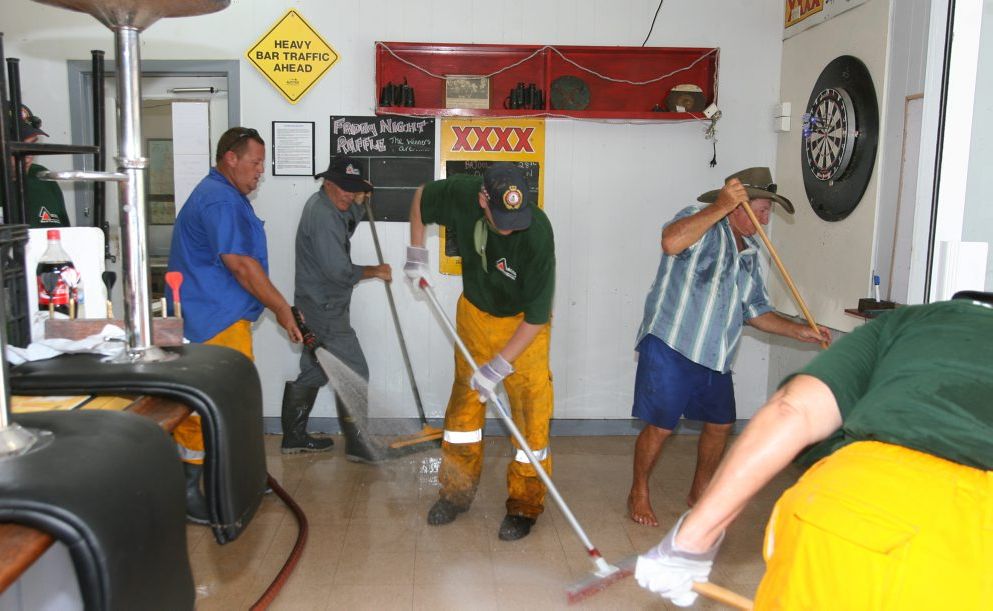 Rural firefighters from Cawarral and The Caves lend a hand to clean up the Bajool Hotel after flash flooding ripped throught the small time south of Rockhampton last Friday as ex Cyclone Oswald dumped heavy rain across Central Queensland. Photo: Chris Ison / The Morning Bulletin Rural firefighters from Cawarral and The Caves lend a hand to clean up the Bajool Hotel after flash flooding ripped throught the small time south of Rockhampton last Friday as ex Cyclone Oswald dumped heavy rain across Central Queensland. Photo: Chris Ison / The Morning Bulletin