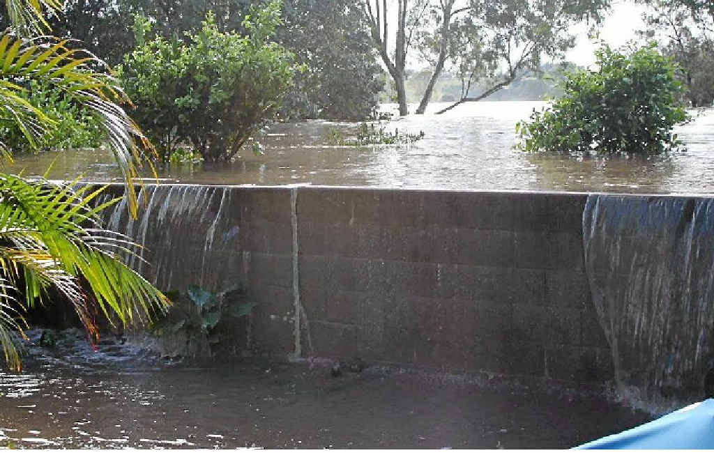 GETTING WET: Fry St resident Aaron Hancock took this photo of water spilling into his yard. GETTING WET: Fry St resident Aaron Hancock took this photo of water spilling into his yard.