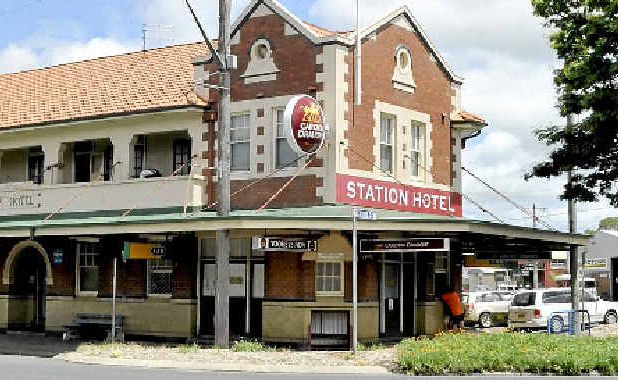 The Station Hotel in South Lismore and, above, a CCTV still of the Banora Point armed robbery. The Station Hotel in South Lismore and, above, a CCTV still of the Banora Point armed robbery.