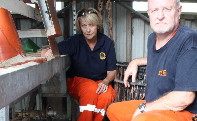 DISAPPOINTING: Ballina State Emergency Service unit volunteers, community education officer Charmaine Robinson and publicity officer Ian Fitzsimmons, inspect the theft of two wheels from the unit's mobile sandbagging machine. Photo Graham Broadhead / Ballina Shire Advocate DISAPPOINTING: Ballina State Emergency Service unit volunteers, community education officer Charmaine Robinson and publicity officer Ian Fitzsimmons, inspect the theft of two wheels from the unit's mobile sandbagging machine. Photo Graham Broadhead / Ballina Shire Advocate