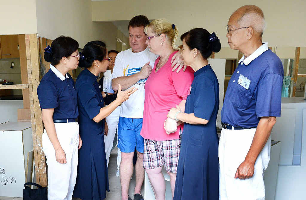 COMFORT: Tzu Chi Foundation Australia Gold Coast CEO Julia Wu (second from left) and other foundation members speak with Kathie and Jose Alonso after the foundation donated $2000 to help the couple rebuild their West Ipswich property. COMFORT: Tzu Chi Foundation Australia Gold Coast CEO Julia Wu (second from left) and other foundation members speak with Kathie and Jose Alonso after the foundation donated $2000 to help the couple rebuild their West Ipswich property.