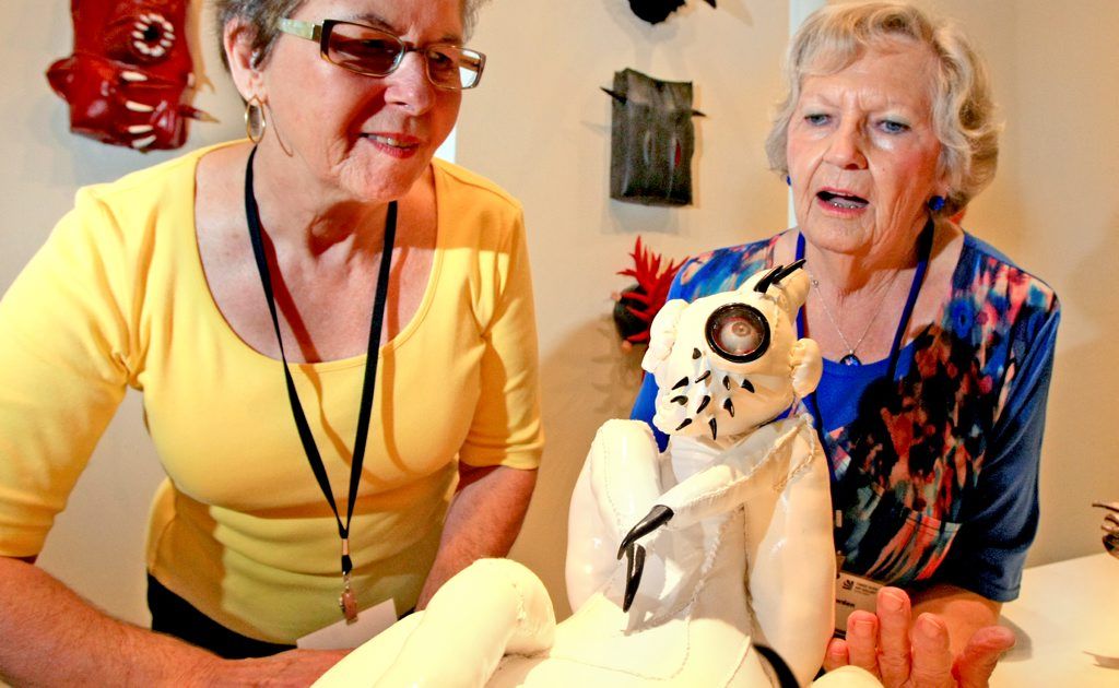 Art Gallery Employee's Nance Lowden(blue) Regina Staines check out one of Erica Gray's works at Tweed River Regional Art Gallery. Art Gallery Employee's Nance Lowden(blue) Regina Staines check out one of Erica Gray's works at Tweed River Regional Art Gallery.