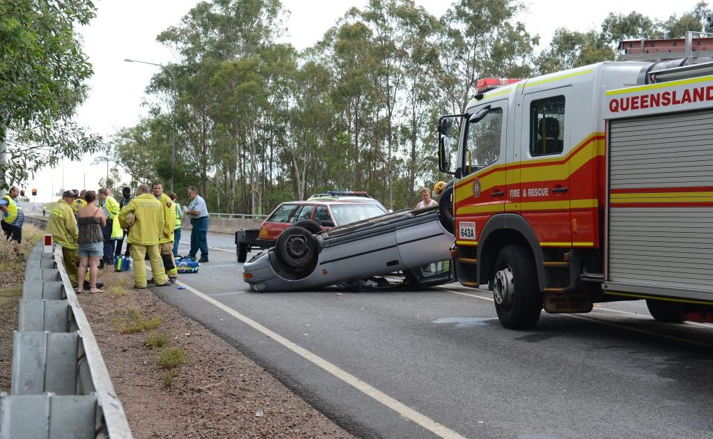 Emergency services attend a car roll over on the Redbank Plains Rd overpass to the Cunningham Highway on Sunday afternoon. Photo: Sarah Harvey / The Queensland Times Emergency services attend a car roll over on the Redbank Plains Rd overpass to the Cunningham Highway on Sunday afternoon. Photo: Sarah Harvey / The Queensland Times