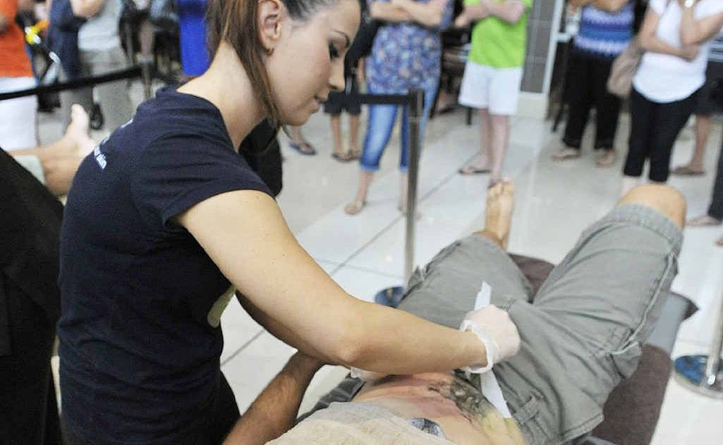 SCREAM MACHINE: David Skeels gets his body hair waxed for Jo Goldstein at Ipswich Riverlink on Saturday. SCREAM MACHINE: David Skeels gets his body hair waxed for Jo Goldstein at Ipswich Riverlink on Saturday.