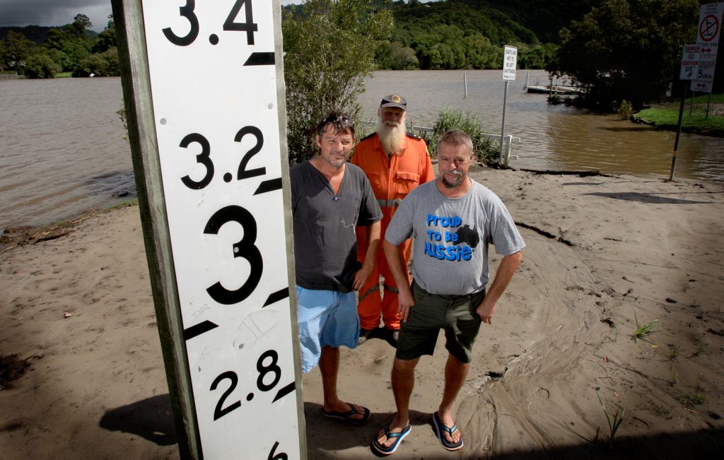 Tumbulgum residents Geoff Butterworth and Gary Whittaker with Phil Davison(middle) from the SES on the bank of the tweed river. Tumbulgum residents Geoff Butterworth and Gary Whittaker with Phil Davison(middle) from the SES on the bank of the tweed river.
