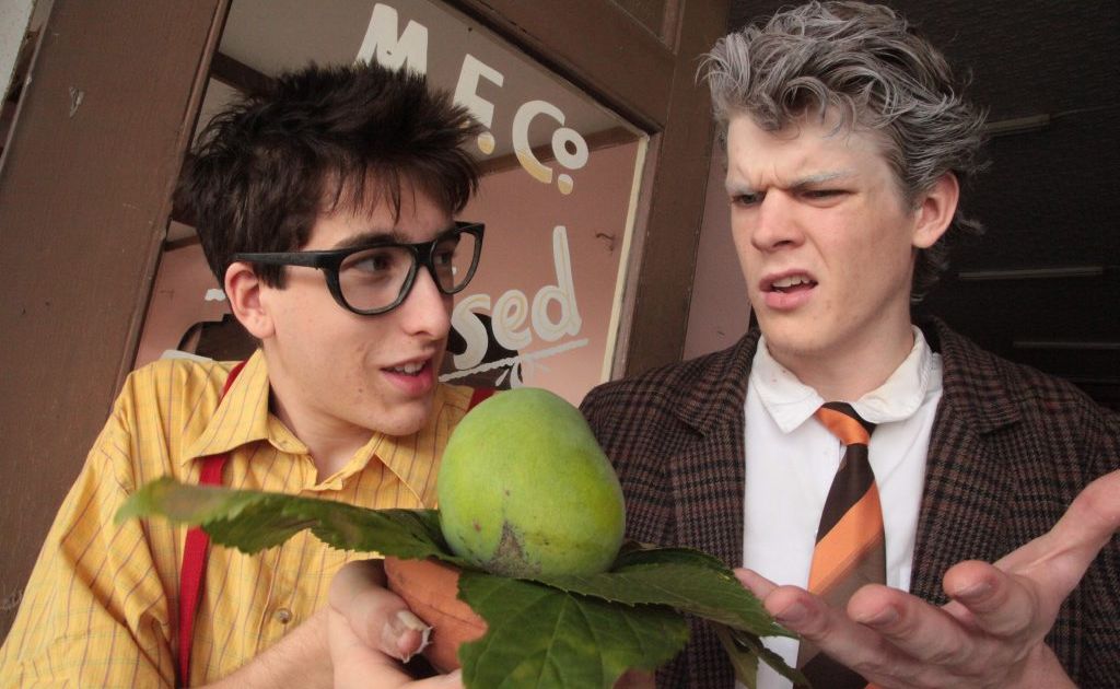 Chris Hubac (Seymour) and Aaron Devine (Mr.Mushnik) look over the Audrey II Bud. Chris Hubac (Seymour) and Aaron Devine (Mr.Mushnik) look over the Audrey II Bud.