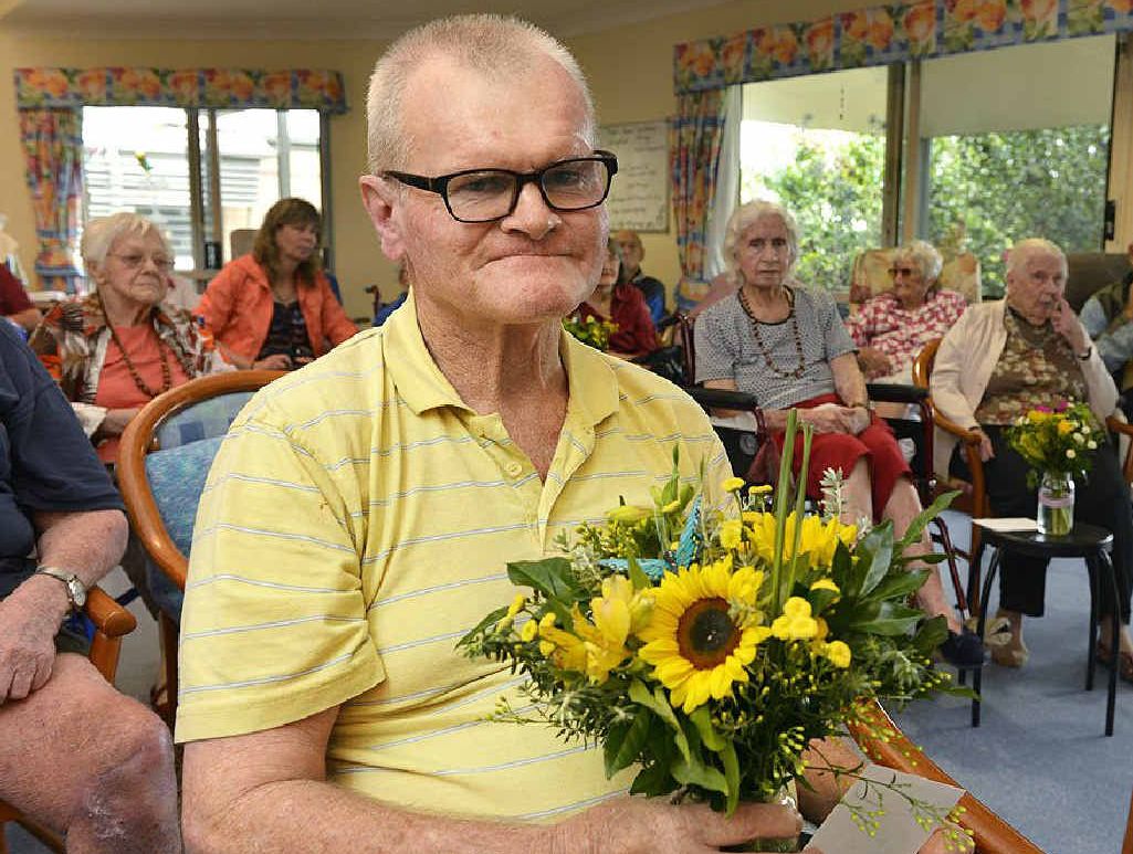 NICE SURPRISE: Barry Woods holds a posie of flowers that was delivered to him by the Flower Project Foundation. NICE SURPRISE: Barry Woods holds a posie of flowers that was delivered to him by the Flower Project Foundation.