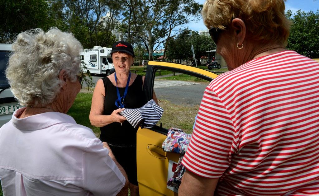 Lyn Borthistle of name church hands out some clothes. Lyn Borthistle of name church hands out some clothes.