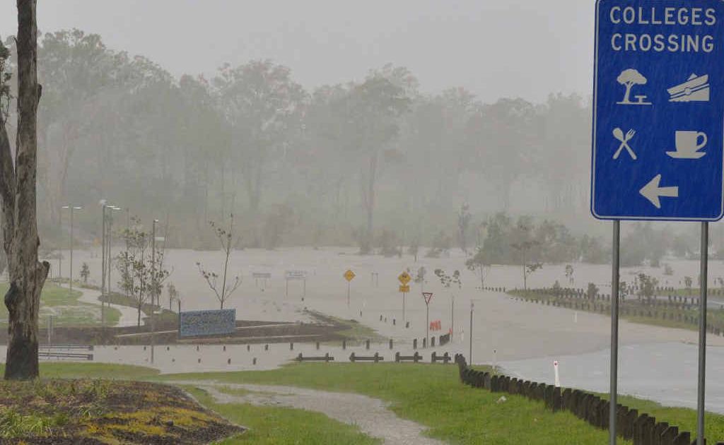 CROSSING UNDER: Floodwaters swamp Colleges Crossing late last month. Locals are hoping new rain forecasts are wrong. CROSSING UNDER: Floodwaters swamp Colleges Crossing late last month. Locals are hoping new rain forecasts are wrong.