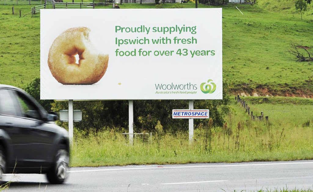 FRESH FOOD: The offending Woolworths billboard; (inset) chef Jamie Oliver. FRESH FOOD: The offending Woolworths billboard; (inset) chef Jamie Oliver.