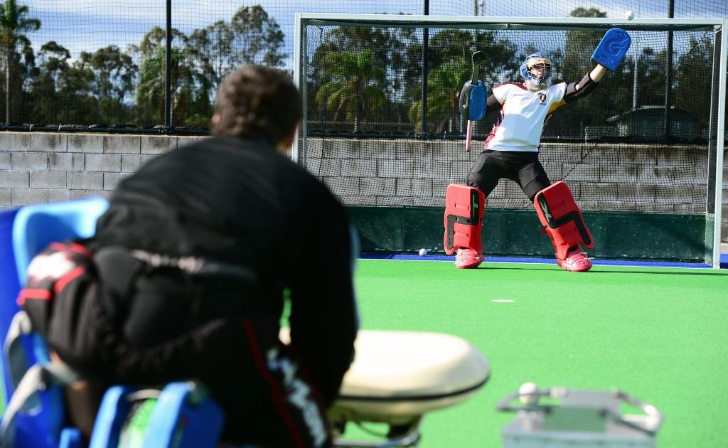 Kyah Andrew-Sharrad practicing his goalkeeping with the help of his father Mark Sharrad. Photo: David Nielsen / The Queensland Times Kyah Andrew-Sharrad practicing his goalkeeping with the help of his father Mark Sharrad. Photo: David Nielsen / The Queensland Times