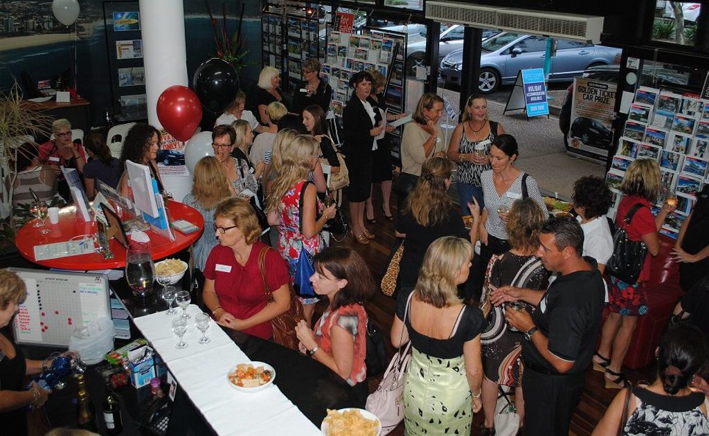 Women gather to find out about a career in real estate. Women gather to find out about a career in real estate.