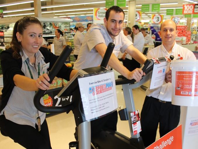 RIDING NOWHERE: Pictured are Coles, Balina, staff on their marathon exercise bike ride in store this week (from left) Simone McUnie, Samuel Smith and trainee store manager Richard Larson. RIDING NOWHERE: Pictured are Coles, Balina, staff on their marathon exercise bike ride in store this week (from left) Simone McUnie, Samuel Smith and trainee store manager Richard Larson.