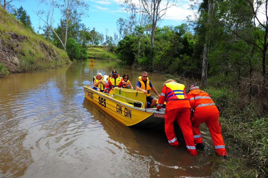 Gin Gin SES volunteers busy ferrying Goodnight Scrub locals across Perry River after flood waters blocked the road. Gin Gin SES volunteers busy ferrying Goodnight Scrub locals across Perry River after flood waters blocked the road.