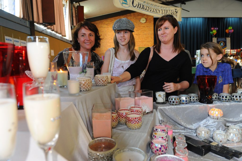SCENTED CANDLES: Michelle Thomas, Ashlyn Howse, Tammy Howse and Hannah Howse look at the selection of scented candles for sale at the Sew What's Crafty Expo. Photo: Mike Knott / NewsMail SCENTED CANDLES: Michelle Thomas, Ashlyn Howse, Tammy Howse and Hannah Howse look at the selection of scented candles for sale at the Sew What's Crafty Expo. Photo: Mike Knott / NewsMail