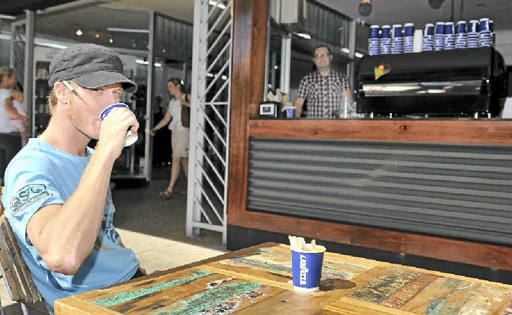 STREET SCENE: Adam Fletcher, barista at the 114 cafe on Keen St in Lismore. In the back Peter Fleming, owner of the cafe. STREET SCENE: Adam Fletcher, barista at the 114 cafe on Keen St in Lismore. In the back Peter Fleming, owner of the cafe.