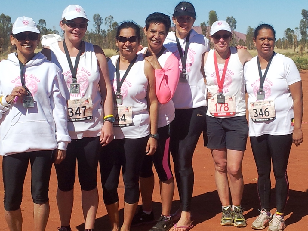 The Deadly Sista Girlz with their medals after the marathon at Uluru(l-r) Roslyn Hart, Kristie Orr, Julie Carey, Janelle Hurley, Vicki Tillott, Maria Wood, Carroll Towney (346 on shirt).
The Deadly Sista Girlz with their medals after the marathon at Uluru(l-r) Roslyn Hart, Kristie Orr, Julie Carey, Janelle Hurley, Vicki Tillott, Maria Wood, Carroll Towney (346 on shirt).