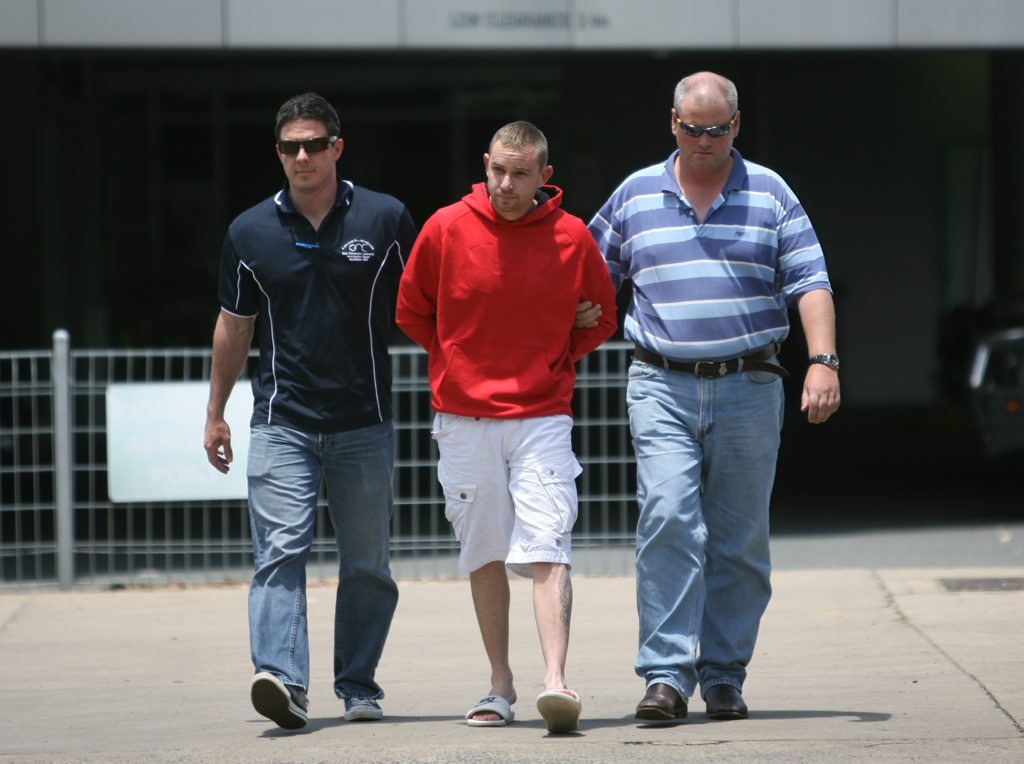 Benjamin Carey's co-accused Jason Robert Ryan being escorted by police from the Rockhampton Police Station to the watchhouse after drug raids in 2011. Benjamin Carey's co-accused Jason Robert Ryan being escorted by police from the Rockhampton Police Station to the watchhouse after drug raids in 2011.