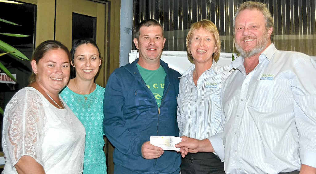 SPECIAL PRESENTATION: After all the hard work at fundraising, the final handover of $26,000 to help Jamie Griffiths (centre) get the help he needs. From left: Tracey Bodley, Rachel Griffiths, Jamie, and representatives of Evans Head Bowling Club, Margo Power and Brett Cooper. SPECIAL PRESENTATION: After all the hard work at fundraising, the final handover of $26,000 to help Jamie Griffiths (centre) get the help he needs. From left: Tracey Bodley, Rachel Griffiths, Jamie, and representatives of Evans Head Bowling Club, Margo Power and Brett Cooper.