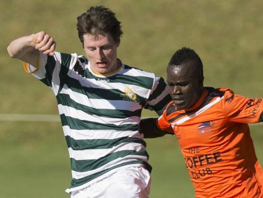BALL BATTLE: Western Pride's Peter Drager fights for the ball with Brisbane Roar striker Julius Doe in Wednesday's trial match at Toowoomba Grammar School. BALL BATTLE: Western Pride's Peter Drager fights for the ball with Brisbane Roar striker Julius Doe in Wednesday's trial match at Toowoomba Grammar School.
