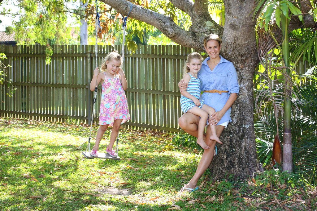 Image for sale: Maroochydore's Jodi Theisen with her daughters Gabriella, 6, (left) and Michaela, 4. New research shows that too much stimulus is not good for kids and Jodi agrees, she is happy to let her girls just be kids and have plenty of play time. Photo: Brett Wortman / Sunshine Coast Daily