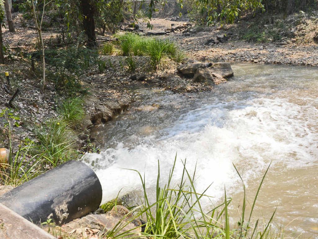 DRAINING AWAY: A pipe pumps water into the downstream section of Goolang Creek. DRAINING AWAY: A pipe pumps water into the downstream section of Goolang Creek.
