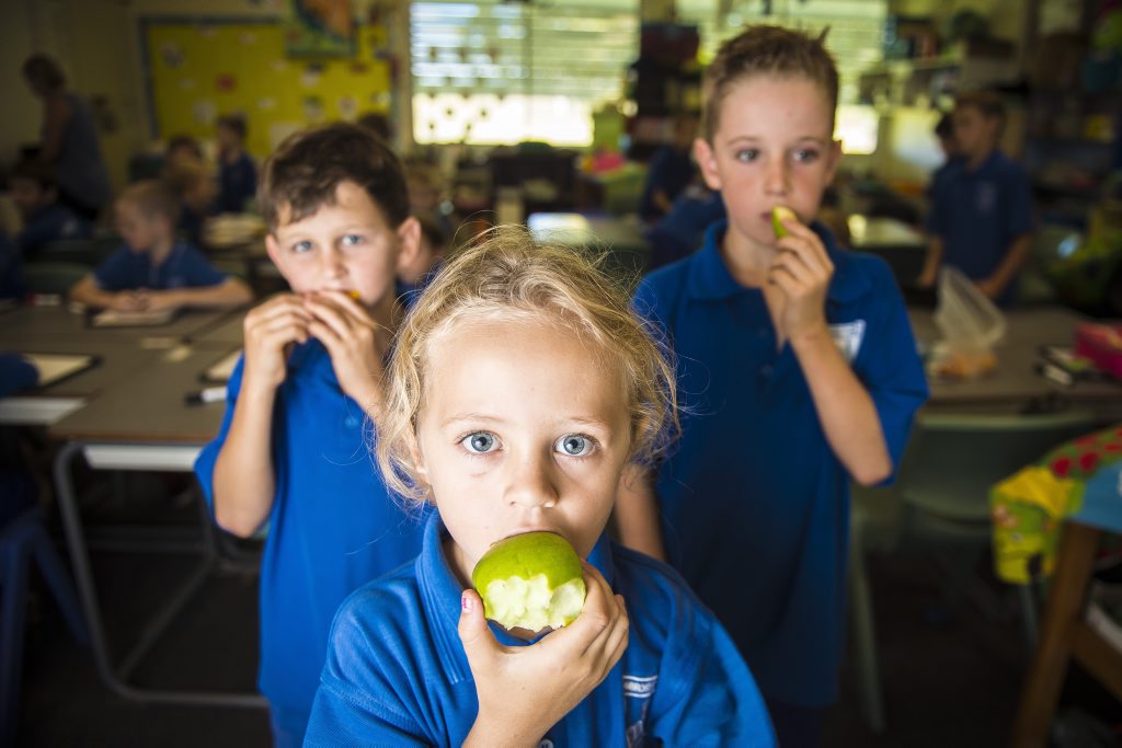 Year 2/3 Ambrose State School students Jacob Creed, 7, Julia Adams, 7, and Tomas Long, 8, enjoying their fruit break. Year 2/3 Ambrose State School students Jacob Creed, 7, Julia Adams, 7, and Tomas Long, 8, enjoying their fruit break.