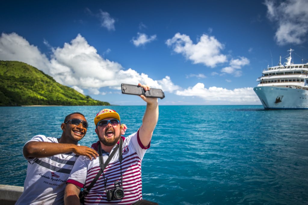 First-time traveller Griffith Thomas enjoying another one of life's first by taking a selfie with Captain Cook Cruises crewman Patrick while visiting Vuaqava Island. First-time traveller Griffith Thomas enjoying another one of life's first by taking a selfie with Captain Cook Cruises crewman Patrick while visiting Vuaqava Island.
