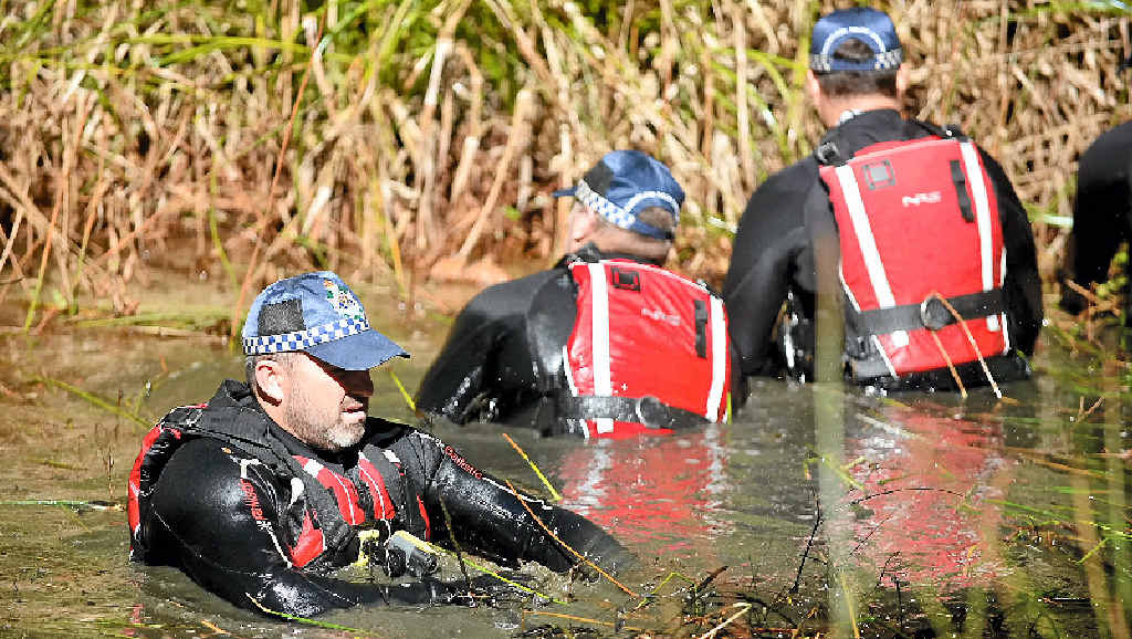 TANAWHA HUNT: Police search a creek for information on murder victim George Gerbic. TANAWHA HUNT: Police search a creek for information on murder victim George Gerbic.