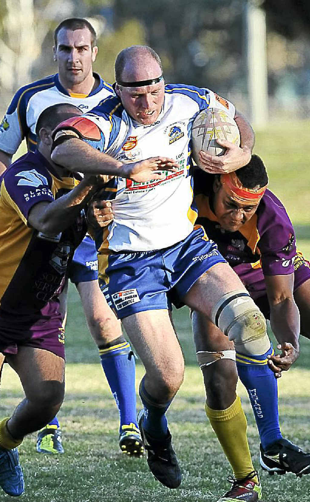 Mustangs’ Lionel Foster attempts bust through two Grafton Rhinos defenders last season. The big prop will be out to post another try or three against Ballina tomorrow. Mustangs’ Lionel Foster attempts bust through two Grafton Rhinos defenders last season. The big prop will be out to post another try or three against Ballina tomorrow.