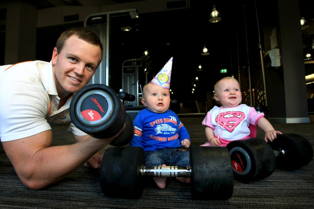 Ruby Wright and Jake Cleverley with strong man Tom Kingston. Photo: John Gass / Daily News Ruby Wright and Jake Cleverley with strong man Tom Kingston. Photo: John Gass / Daily News