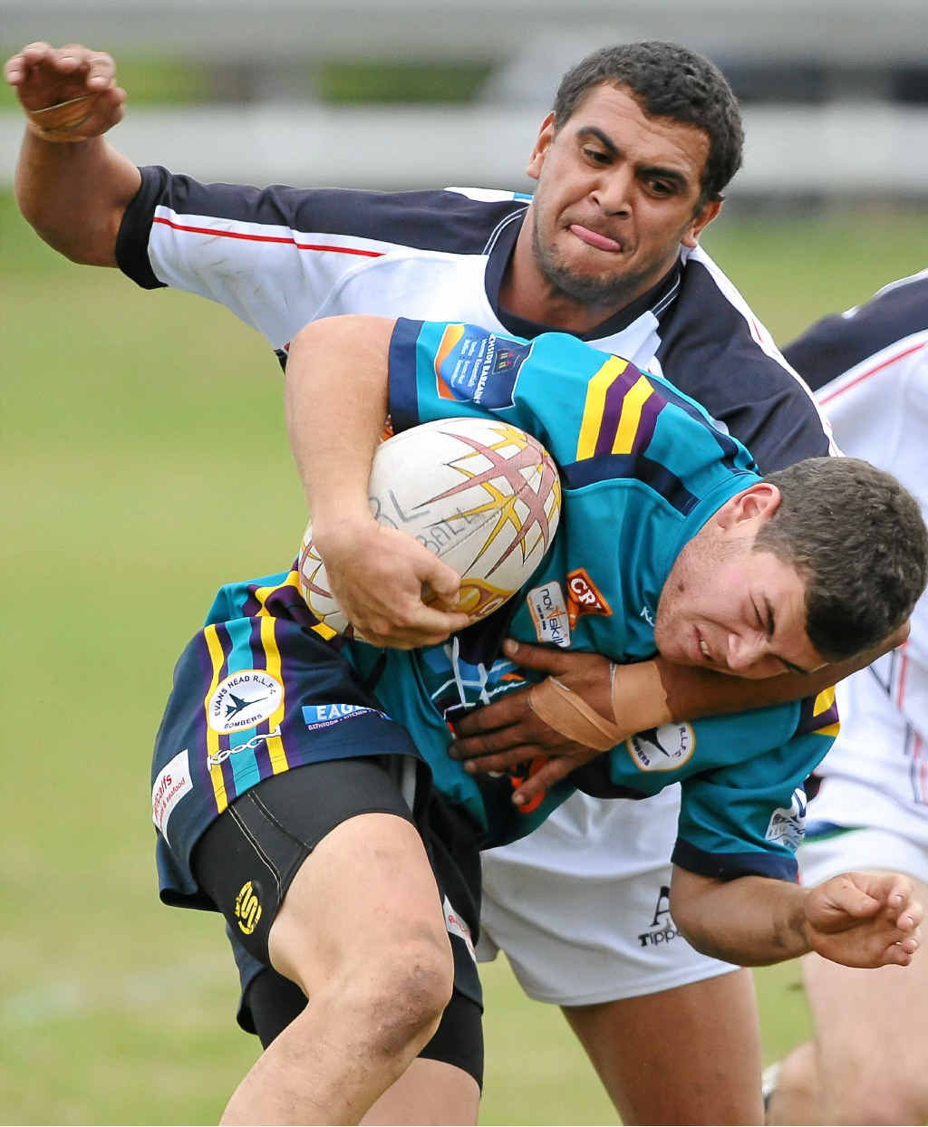 CHOP DOWN: Lower Clarence defender Grant Brown hits his Evans Head opponent with a strong tackle. Photo: Adam Hourigan CHOP DOWN: Lower Clarence defender Grant Brown hits his Evans Head opponent with a strong tackle. Photo: Adam Hourigan
