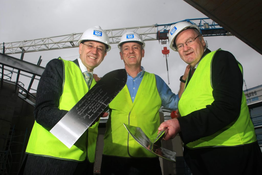 Vice chancellor Peter Lee, Rob Yates of Hutchinson Builders and SCU chancellor John Dowd at a topping out ceremony to celebration a construction milestone at SCU Gold Coast-Tweed campus. Vice chancellor Peter Lee, Rob Yates of Hutchinson Builders and SCU chancellor John Dowd at a topping out ceremony to celebration a construction milestone at SCU Gold Coast-Tweed campus.