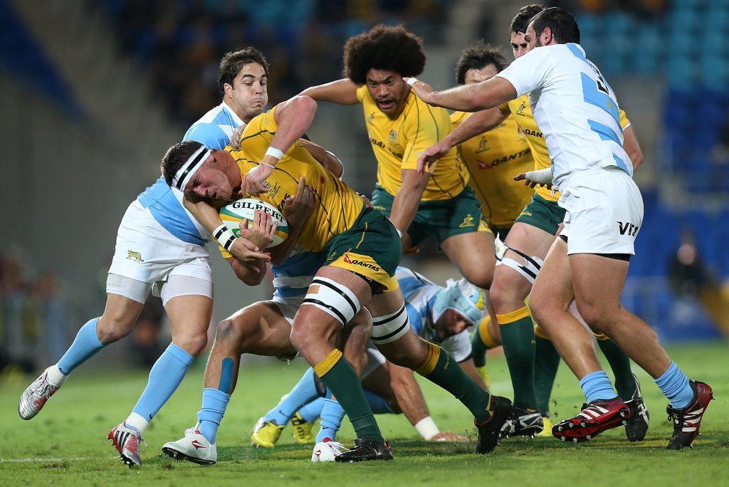 GOLD COAST, AUSTRALIA - SEPTEMBER 15: Kane Douglas of the Australian Wallabies is tackled during the Rugby Championship match between the Australian Wallabies and Argentina at Skilled Park on September 15, 2012 on the Gold Coast, Australia. (Photo by Chris Hyde/Getty Images) GOLD COAST, AUSTRALIA - SEPTEMBER 15: Kane Douglas of the Australian Wallabies is tackled during the Rugby Championship match between the Australian Wallabies and Argentina at Skilled Park on September 15, 2012 on the Gold Coast, Australia. (Photo by Chris Hyde/Getty Images)
