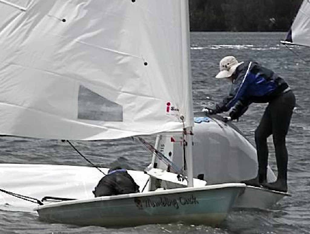 A Big River Sailing Club competitor works on righting his capsized craft. PHOTO: CONTRIBUTED A Big River Sailing Club competitor works on righting his capsized craft. PHOTO: CONTRIBUTED