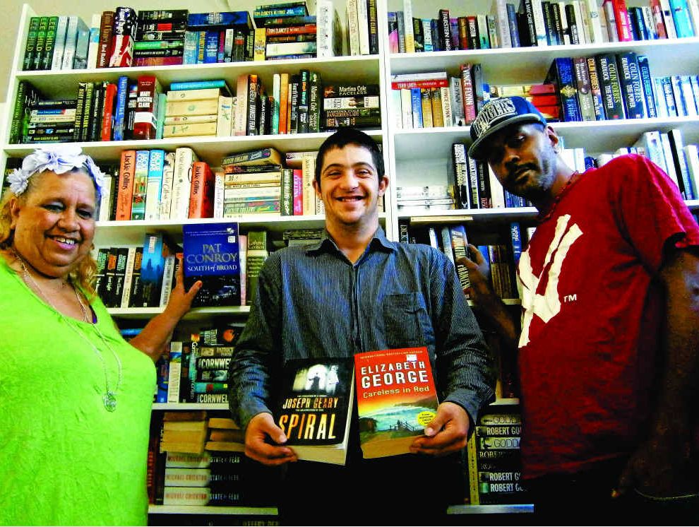 Celebrating the 40th birthday of Yellow Door Books and Gifts at Yeppoon are (from left) Janelle Havig, Rikki Gambin and Aaron Albury. Celebrating the 40th birthday of Yellow Door Books and Gifts at Yeppoon are (from left) Janelle Havig, Rikki Gambin and Aaron Albury.