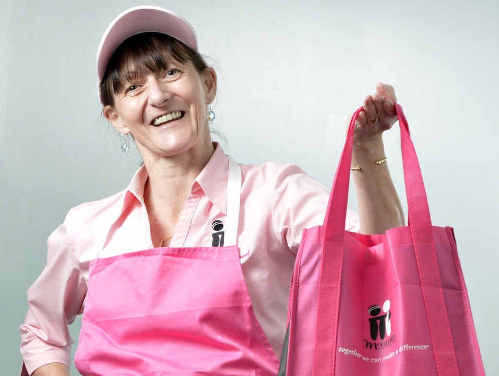 CARING SMILE: McGrath Foundation breast care Nurse Karen Miles with fundraising items. CARING SMILE: McGrath Foundation breast care Nurse Karen Miles with fundraising items.