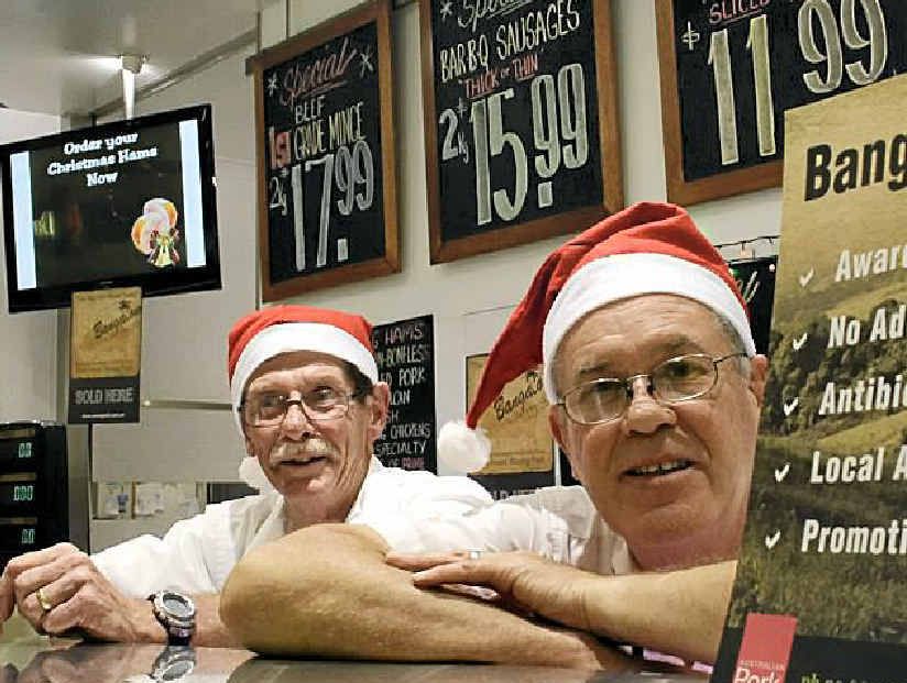 Grafton Shoppingworld butchers Jeff Newsom and Noel Woodcock take a quick break from preparing for the shopping rush. Photo: Kate Matthews Grafton Shoppingworld butchers Jeff Newsom and Noel Woodcock take a quick break from preparing for the shopping rush. Photo: Kate Matthews