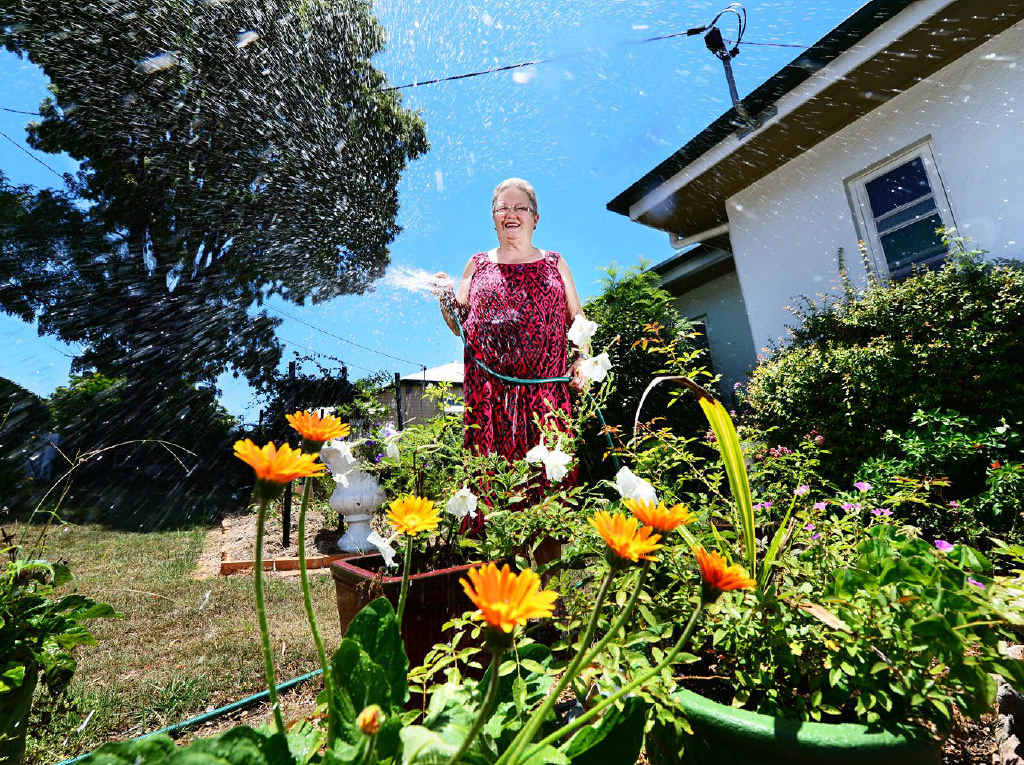 SPLASHING OUT: Ipswich Horticultural Society president Dawn Jones warns of higher costs as water restrictions end. SPLASHING OUT: Ipswich Horticultural Society president Dawn Jones warns of higher costs as water restrictions end.